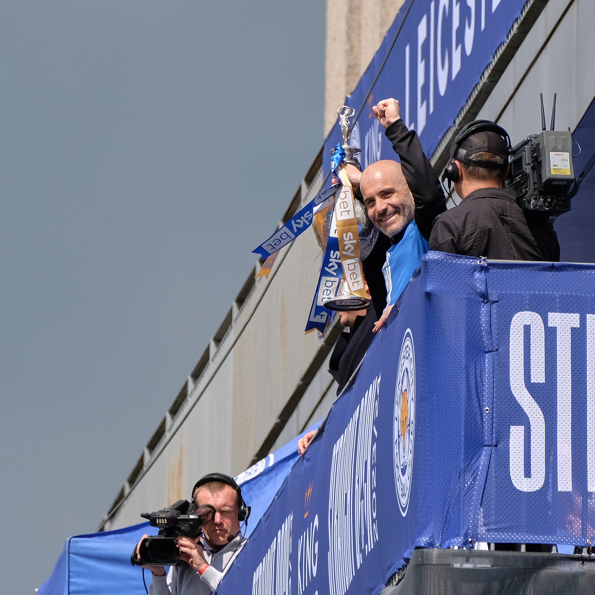 Enzo Maresca lifts the Championship trophy at Haymarket, Leicester, during the 2024 winners' parade